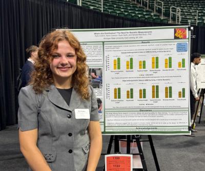 woman presenting a poster