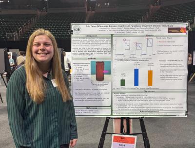 woman presenting a poster