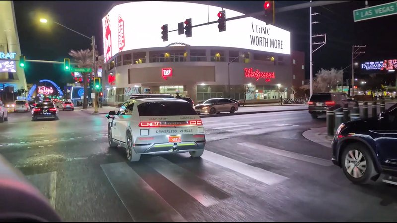 Driverless autonomous vehicle driving at night on Las Vegas streets
