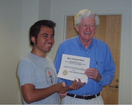 José Mendoza-Cortés receiving the best-poster certificate at the 2010 ICMR workshop, with Michael O'Keeffe.